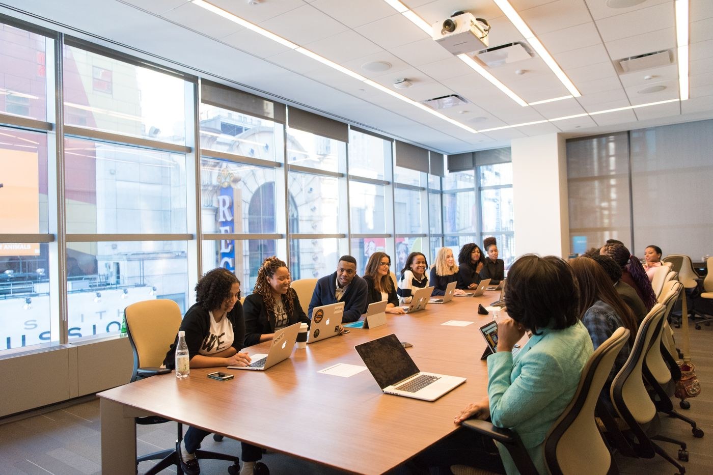 Round-table vault session with learners discussing AI financial dashboard designs